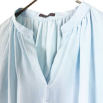 Load image into Gallery viewer, 【中古】セオリーリュクス Theory luxe ギャザー半袖ブラウス スタンドカラー スキッパー ライトブルー 水色 i0807n0096
